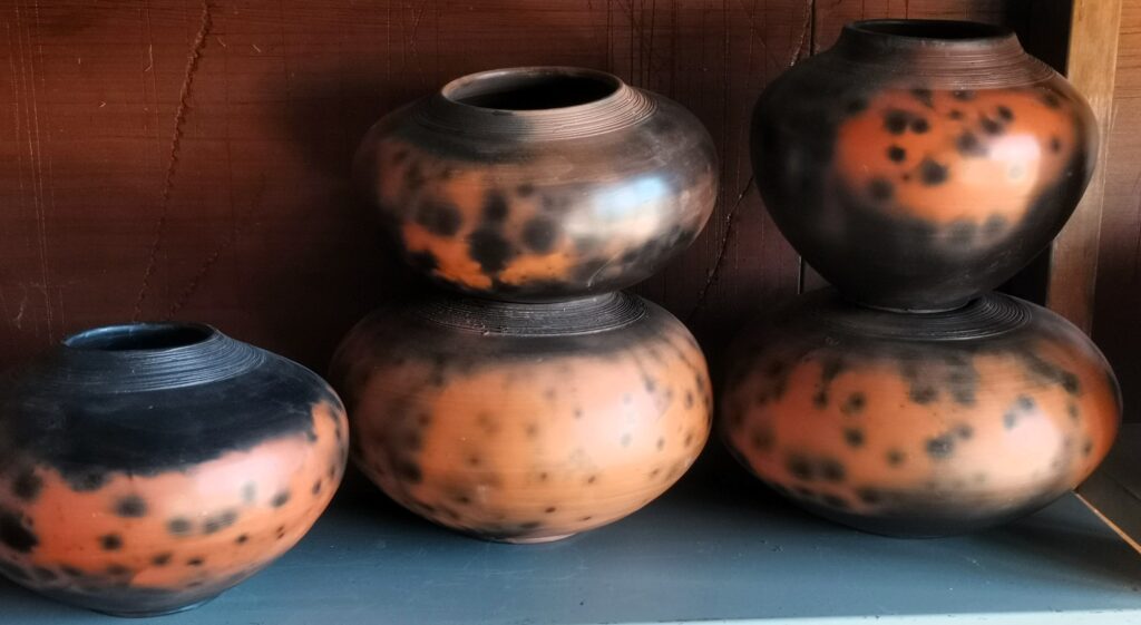 brown pots stacked in store